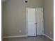 Bedroom features neutral walls and a large closet with white panel doors at 2678 Brook Park Way, Atlanta, GA 30340