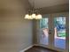 Dining area with chandelier and access to back porch at 2678 Brook Park Way, Atlanta, GA 30340