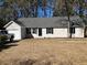 Charming single-story home with neutral siding, black shutters, and a single-car garage at 2678 Brook Park Way, Atlanta, GA 30340