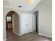 Hallway with white trim, wood-look floors, and white doors leading to other rooms at 2678 Brook Park Way, Atlanta, GA 30340