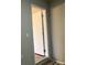 Hallway featuring neutral walls and trim leading to a white interior door at 2678 Brook Park Way, Atlanta, GA 30340