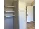 Kitchen displays white cabinets, shelving, and gray walls at 2678 Brook Park Way, Atlanta, GA 30340