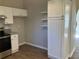 Kitchen includes white cabinetry, light countertops, stainless steel oven and wood flooring at 2678 Brook Park Way, Atlanta, GA 30340
