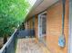 Balcony featuring a wood floor, brick wall, and black metal guard rail at 115 Biscayne Dr # C2, Atlanta, GA 30309
