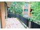 Balcony with metal railing overlooking a wooded area and building exterior at 115 Biscayne Dr # C2, Atlanta, GA 30309