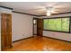 Spacious bedroom features hardwood floors, and a bright window with green views at 115 Biscayne Dr # C2, Atlanta, GA 30309