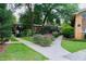 The exterior shows landscaped grounds and well-maintained brick buildings at 115 Biscayne Dr # C2, Atlanta, GA 30309