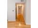 Hallway with hardwood floors leading to rooms, neutral wall color, and closet space at 115 Biscayne Dr # C2, Atlanta, GA 30309