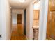 Hallway leading to a bathroom with a pedestal sink and a doorway to another room at 115 Biscayne Dr # C2, Atlanta, GA 30309