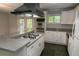 Contemporary kitchen featuring granite countertops, white cabinetry, and stainless appliances at 115 Biscayne Dr # C2, Atlanta, GA 30309