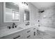 Bathroom features double sinks, sleek fixtures, and tiled shower/tub at 2623 Regal Cir, Lawrenceville, GA 30044