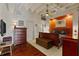 Bedroom with an orange accent wall and a ceiling fan at 805 Peachtree Ne St # 614, Atlanta, GA 30308