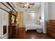 Cozy bedroom featuring hardwood floors, neutral decor, and ample natural light at 805 Peachtree Ne St # 614, Atlanta, GA 30308