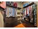 Well-organized walk-in closet with ample storage space, dark wood drawers and shelving at 805 Peachtree Ne St # 614, Atlanta, GA 30308