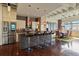 Modern kitchen with a tiled island, stainless steel appliances, and sleek cabinetry adjacent to dining space at 805 Peachtree Ne St # 614, Atlanta, GA 30308