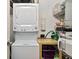 Laundry room with stacked washer and dryer, plus storage and utility features at 805 Peachtree Ne St # 614, Atlanta, GA 30308