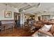 Spacious living room boasts an open concept, hardwood floors, and exposed industrial ceiling at 805 Peachtree Ne St # 614, Atlanta, GA 30308