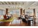 Open living and dining space featuring hardwood floors, expansive windows and an exposed ceiling with ductwork at 805 Peachtree Ne St # 614, Atlanta, GA 30308
