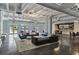 Open lounge with modern furniture, polished concrete floors, and ample natural light at 805 Peachtree Ne St # 614, Atlanta, GA 30308