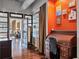 Office space with an orange accent wall, desk, and chair at 805 Peachtree Ne St # 614, Atlanta, GA 30308