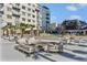 Outdoor patio area featuring firepit, palm trees and ample seating at 805 Peachtree Ne St # 614, Atlanta, GA 30308