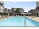 Outdoor swimming pool and lounge chairs offer a relaxing space in a sunny setting at 805 Peachtree Ne St # 614, Atlanta, GA 30308