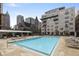 Outdoor swimming pool with lounge chairs offers a relaxing space in a sunny setting at 805 Peachtree Ne St # 614, Atlanta, GA 30308