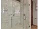 Luxurious shower with marble tiling, glass enclosure, rainfall showerhead, and built-in bench at 805 Peachtree Ne St # 614, Atlanta, GA 30308