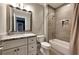 Bathroom features a granite countertop, white cabinets, bathtub, and shower with tile surround at 4230 Rickenbacker Ne Way, Atlanta, GA 30342