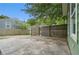 An exterior view of the backyard fenced for privacy with a concrete parking pad at 490 Rockwell Sw St, Atlanta, GA 30310