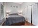 Clean bedroom features hardwood flooring, a large window, and ample closet space at 490 Rockwell Sw St, Atlanta, GA 30310