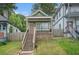 Charming home with a stone foundation and a covered front porch, enhanced by a well-maintained lawn at 490 Rockwell Sw St, Atlanta, GA 30310