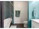 Stylish bathroom features a soaking tub, teal accent wall, and modern fixtures at 1250 Parkwood Se Cir # 2114, Atlanta, GA 30339