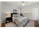 Comfortable bedroom with plantation shutters, ceiling fan, and soft, neutral decor at 1250 Parkwood Se Cir # 2114, Atlanta, GA 30339