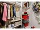 Organized closet featuring clothing, storage bins, and shelving for efficient space utilization at 1250 Parkwood Se Cir # 2114, Atlanta, GA 30339