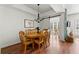 Dining area with wood table and chairs next to windows and electric fireplace at 1250 Parkwood Se Cir # 2114, Atlanta, GA 30339
