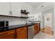 Well-appointed kitchen boasts stainless steel appliances, open shelving, and seamless flow into the living area at 1250 Parkwood Se Cir # 2114, Atlanta, GA 30339