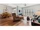 Open-concept living and dining area with modern furnishings and hardwood floors at 1250 Parkwood Se Cir # 2114, Atlanta, GA 30339