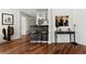 Inviting living area featuring hardwood floors, unique decor, and seamlessly connects to the kitchen at 1250 Parkwood Se Cir # 2114, Atlanta, GA 30339