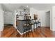 Open-concept living space showcases hardwood floors, stylish bar seating, and a seamless transition to the kitchen at 1250 Parkwood Se Cir # 2114, Atlanta, GA 30339