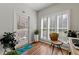 Cozy sunroom features natural light, plantation shutters, and a tranquil view of the outdoors at 1250 Parkwood Se Cir # 2114, Atlanta, GA 30339