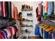 Spacious walk-in closet with ample storage for clothing and shoes on multiple racks and shelves at 1250 Parkwood Se Cir # 2114, Atlanta, GA 30339