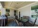 Covered deck featuring a dining table and chairs, offering a cozy outdoor dining experience at 2845 Jims Ne Rd, Marietta, GA 30066