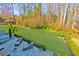 An aerial view of a backyard with well manicured lawn, landscaping, and a beautiful outdoor patio at 2845 Jims Ne Rd, Marietta, GA 30066