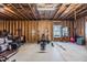 Unfinished basement with exposed beams, concrete flooring, and exercise equipment at 2845 Jims Ne Rd, Marietta, GA 30066