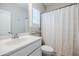 Bright bathroom with a clean vanity, a neutral shower curtain, and a window bringing natural light to the space at 2845 Jims Ne Rd, Marietta, GA 30066