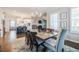 Inviting dining room with a long wooden table, elegant chairs, and a view into the open kitchen at 2845 Jims Ne Rd, Marietta, GA 30066