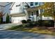 Well-maintained home with manicured lawn, flower beds, attached garage, and a covered front porch at 2845 Jims Ne Rd, Marietta, GA 30066