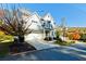 Charming two-story home with a two-car garage, a well-kept lawn, and vibrant fall foliage at 2845 Jims Ne Rd, Marietta, GA 30066