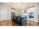 Stylish kitchen with a gray island, stainless steel appliances, sleek lighting, and hardwood floors at 2845 Jims Ne Rd, Marietta, GA 30066